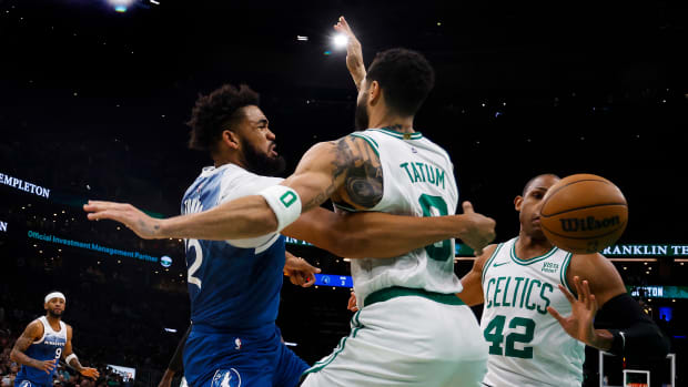 Karl-Anthony Towns tries to pass around Jason Tatum